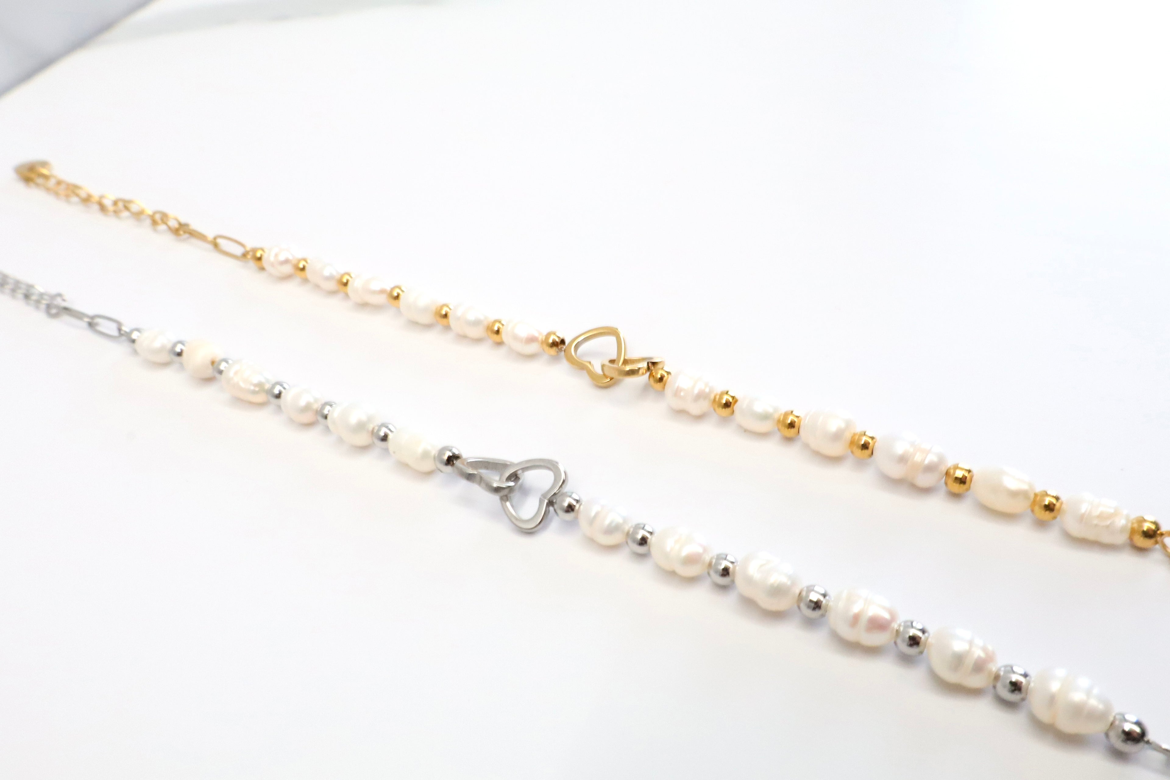 Armband met parels en verbindingshartje